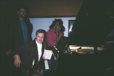 La Fleur Paysour, Ned Rorem and Charles Amirkhanian (l to r), next to piano, facing forward, Berkeley CA. 1987