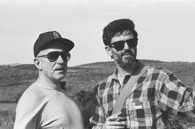 Half length portrait of Erik Bauersfeld (left) and Charles Amirkhanian looking right, at Point Reyes, CA (1980s)