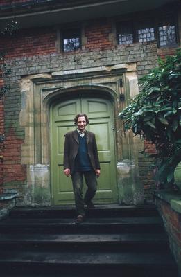 Full Length portrait of Henri Chopin on the steps outside his home in Ingatestone (1972)
