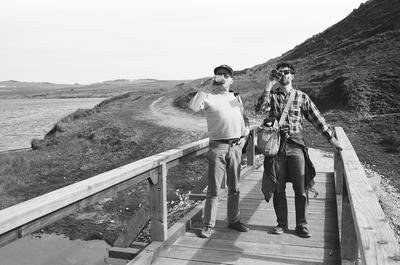 Full length portrait of Erik Bauersfeld (left) and Charles Amirkhanian on a bridge at Point Reyes, CA (1980s)