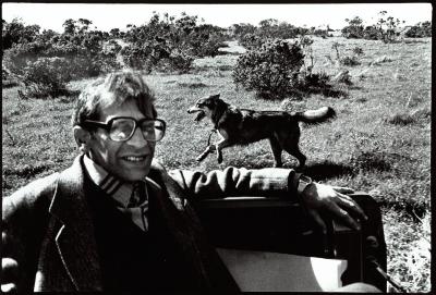 Ashot Zograbyan, head and shoulders portrait, seated, facing slightly right, with dog in background, Woodside CA, (1995)