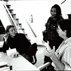 Laetitia Sonami, Pamela Z, and Paul Dresher, half length portrait, in discussion around a conference table, (1997) [side view]
