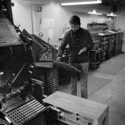 Ceasar Villanueva and Walter Ellis in a work room of the Ellis Rubber Stamp Co., 1973