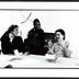Laetitia Sonami, Pamela Z, and Paul Dresher, half length portrait, in discussion around a conference table, (1997)