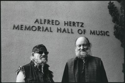 LaMonte Young and Terry Riley, half length portrait outside Hertz Hall in Berkeley, CA (1996)