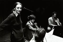 Aleksandra Vrebalov, standing and facing forward and Leighton Fong, & Kurt Rohde playing their instruments, San Francisco CA, (2001)