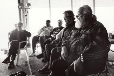 Two unidentified individuals, Randy Weston, Pauline Oliveros, Tania León, Thomas Buckner, and Lou Harrison, full length portrait, seated, facing left, Woodside CA, (2002)