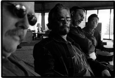 Stephen Scott, Daniel Lentz, Stephan Micus, and Ge Gan-ru, head and shoulders portrait, seated at table, heads turned to camera, Woodside CA, (2003)