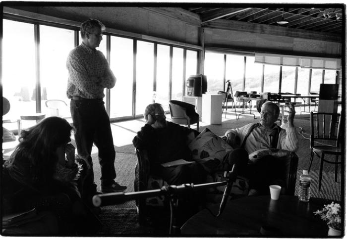 Evelyn Glennie, Charles Amirkhanian, standing, Jack Body, and Ned Rorem, rest are seated, having a discussion, Woodside CA, (2003)