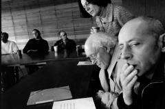 Amelia Cuni, looks over the shoulder of Francis Dhomont, as Werner Durand stifles a yawn and other featured OM 10 composers look on, Woodside CA, (2004)