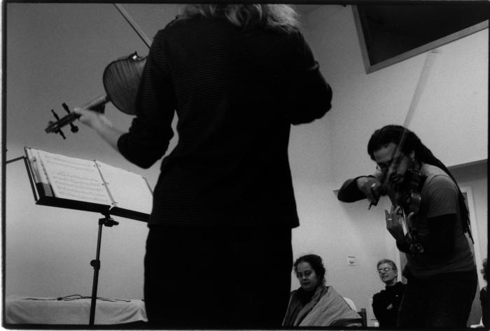 Kate Stenberg, standing, back to camera, and Daniel Bernard Roumain playing violin, Woodside, CA (2005)