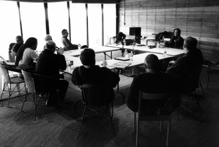 OM 11 participants seated around a table during private discussions at the Djerassi Resident Artists Program, Woodside, CA (2005)