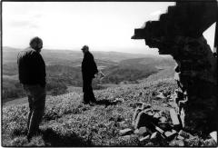 Phil Niblock and Michael Nyman standing on a hill, full length portrait, Woodside, CA (2005)  