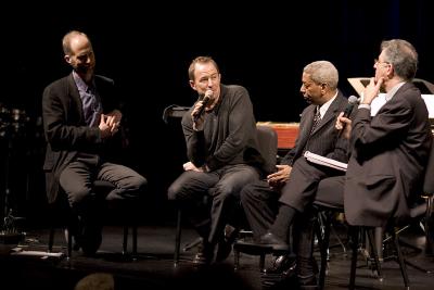 John Luther Adams, Evan Ziporyn, Billy Bang, and Charles Amirkhanian, seated, during panel discussion, ver. 15, San Francisco CA (2005)