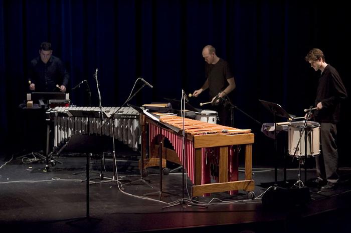 Adam Sliwinski, Jason Treuting, and Robert Esler performing on stage during OM 11, San Francisco CA (2005)