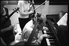 Per Nørgård seated and playing piano during a rehearsal with the Del Sol String Quartet, Woodside CA, 2006 