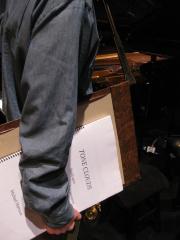 The arm of Michael Harrison holding the score to his composition “Tone Clouds,” San Francisco