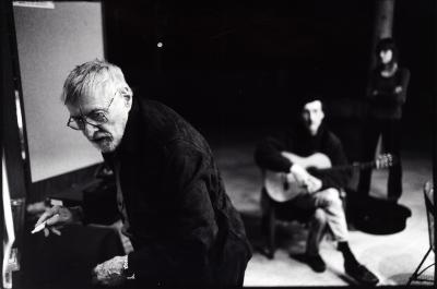 Ben Johnston, standing, facing slightly left and down, & John Schneider, seated, holding a guitar, Woodside Ca, (2009)