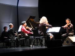 Pianist Michael Harrison with the Del Sol String Quartet, full length portrait, performing on stage, San Francisco