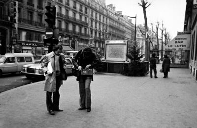 Bernard Heidsieck looks down as Charles Amirkhanian checks equipment, Paris, 1973