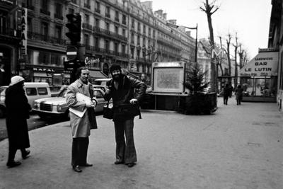 Bernard Heidsieck and Charles Amirkhanian, full-length portrait, on a sidewalk in Paris, 1973