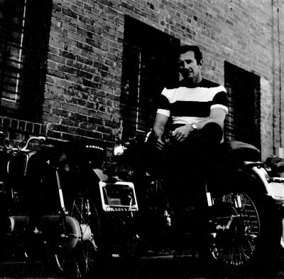 Portrait of Philip Levine sitting on his motorcycle in Fresno, CA