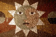 Close up of detail of the sun with a face, from a mosaic by Juan O’Gorman, Mexico City