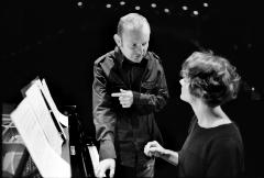 Paweł Mykietyn, three-quarter length portrait, discusses a score with pianist Eva-Maria Zimmermann, San Francisco