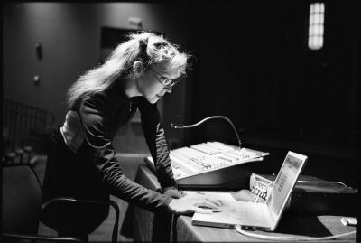 Natasha Barrett, three quarter length portrait, standing, facing right and slightly down at computer, San Francisco CA., vs 2 (2010)