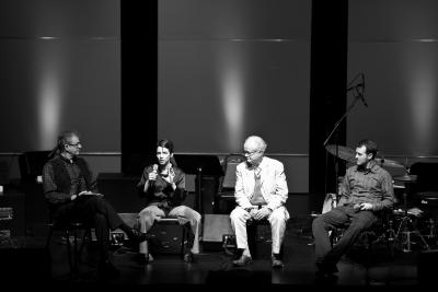 Charles Amirkhanian, Carla Kihlstedt, Tom Johnson, & Gyan Riley, full length portrait, seated, during panel discussion, San Francisco CA., (2010)