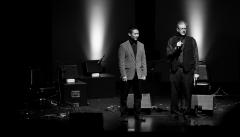 Adam Fong & Charles Amirkhanian, full length portrait, standing on stage, facing slightly right, San Francisco CA., (2010)
