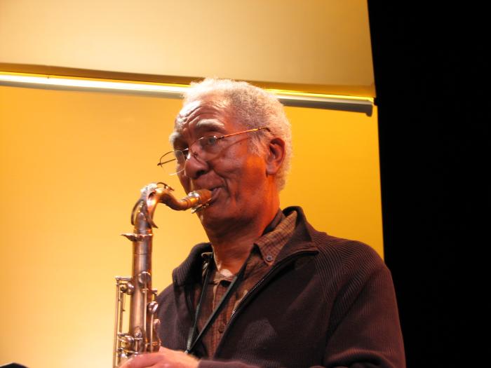 Kidd Jordan, head and shoulders portrait, playing saxophone during a rehearsal for OM 15, San Francisco CA., (2010)