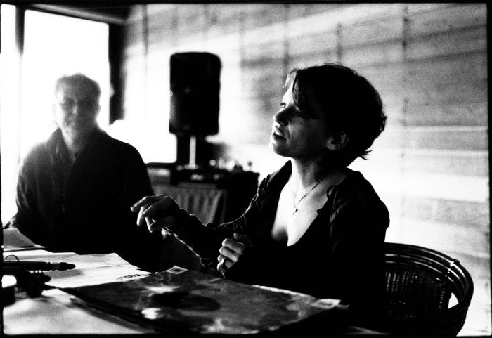 Carla Kihlstedt (r), gives a presentation as Charles Amirkhanian looks on, seated, head and shoulders portrait, Woodside CA., (2010)