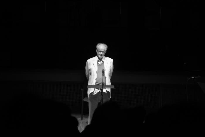 Tom Johnson, full length portrait, standing at a podium, facing forward, San Francisco