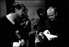 Charlton Lee, Kate Stenberg, Rick Shinozaki, & Paweł Mykietyn (l to r), half length portrait, examining score, during a rehearsal, (2010)