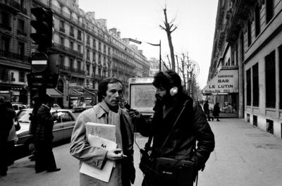 Bernard Heidsieck being interviewed by Charles Amirkhanian in the middle of a sidewalk in Paris, 1973