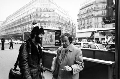 Charles Amirkhanian and Bernard Heidsieck, three quarters portrait, standing by the Chausée D'Antin metro station in Paris, 1973