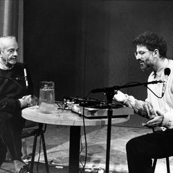 Astor Piazzolla sits across a table from Charles Amirkhanian at the Cowell Bayfront Theater,  San Francisco, 1989