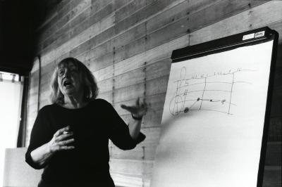 Gloria Coates, standing with an easel notepad during her presentation at the Djerassi Resident Artists Program, Woodside CA (2012)