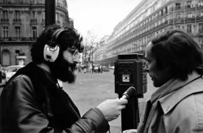 Profile of Charles Amirkhanian and Bernard Heidsieck during an interview on a Parisian street, 1973