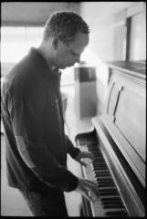 Craig Taborn, standing, playing piano, Woodside, CA (2013)