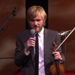 Violinist Rune Tonsgaard Sørensen of Trio Gáman making introductions before a performance at OM 18, San Francisco CA (2013)