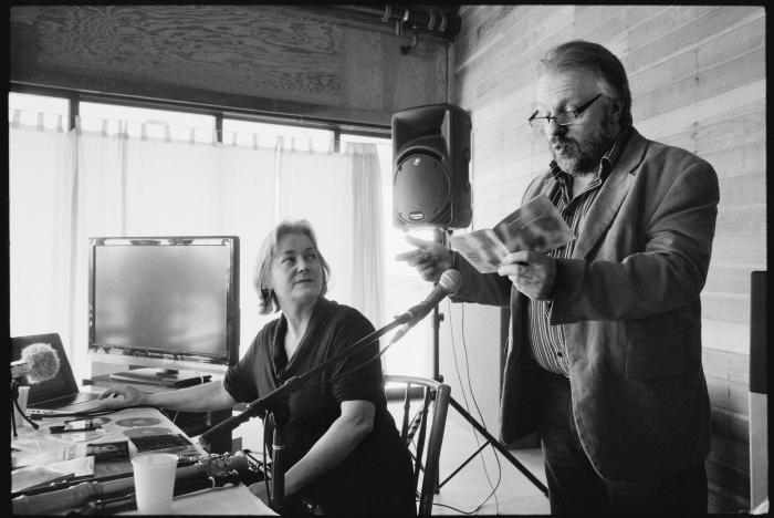 Michala Petri, seated, looking at Sunleif Rasmussen, standing talking to fellow artists about his music, Woodside, CA (2013)