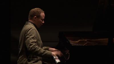 Craig Taborn seated onstage at the piano during the second concert of OM 18, vs. 4, San Francisco CA (2013)
