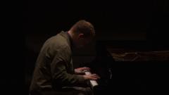 Craig Taborn seated onstage at the piano during the second concert of OM 18, vs. 8, San Francisco CA (2013)