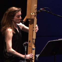 Anna Petrini seated onstage with her Paetzold contrabass recorder during the second concert of OM 18, vs. 4, San Francisco CA (2013)