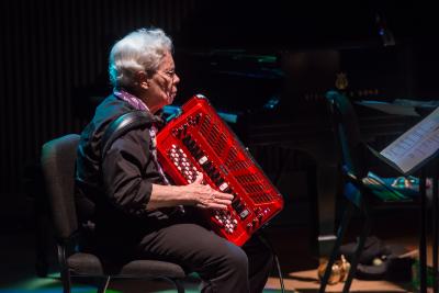 Pauline Oliveros playing accordion during the second concert of OM 20, San Francisco CA (2015)