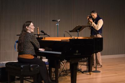 Meredith Monk at the piano being photographed by John Fago prior to the third concert of OM 21, San Francisco CA (2016)