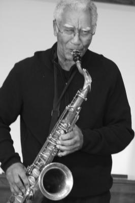 Kidd Jordan, half length portrait, standing, facing forward, playing the saxophone, Woodside CA., (2010)