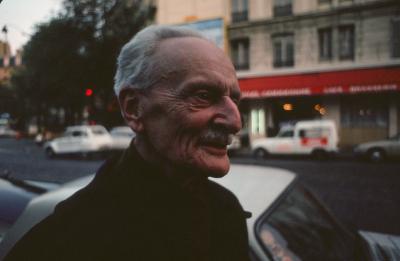 Ivan Wyschnegradsky, looking right, while on a street in Paris (1976)